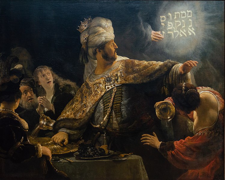 King Belshazzar sees a disembodied hand write the words "מנא מנא תקל ופרסין" on the wall. This interrupts his meal. Numbered, numbered, weighed, divided.